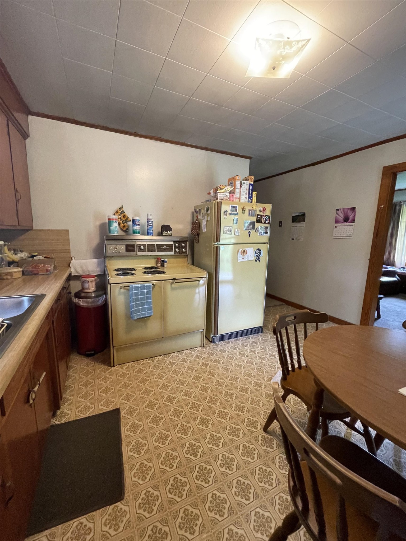961 Highway 57 Ramer, TN 38367 - Photo 3 of 9 a kitchen with a stove a refrigerator and a stove top oven