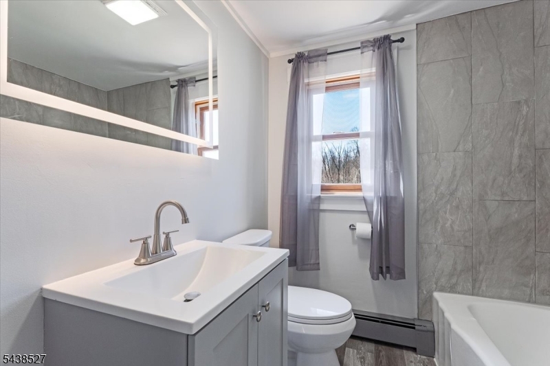 83 Highway 15 Lafayette, NJ 07848 - Photo 11 of 20 a bathroom with a sink toilet and shower