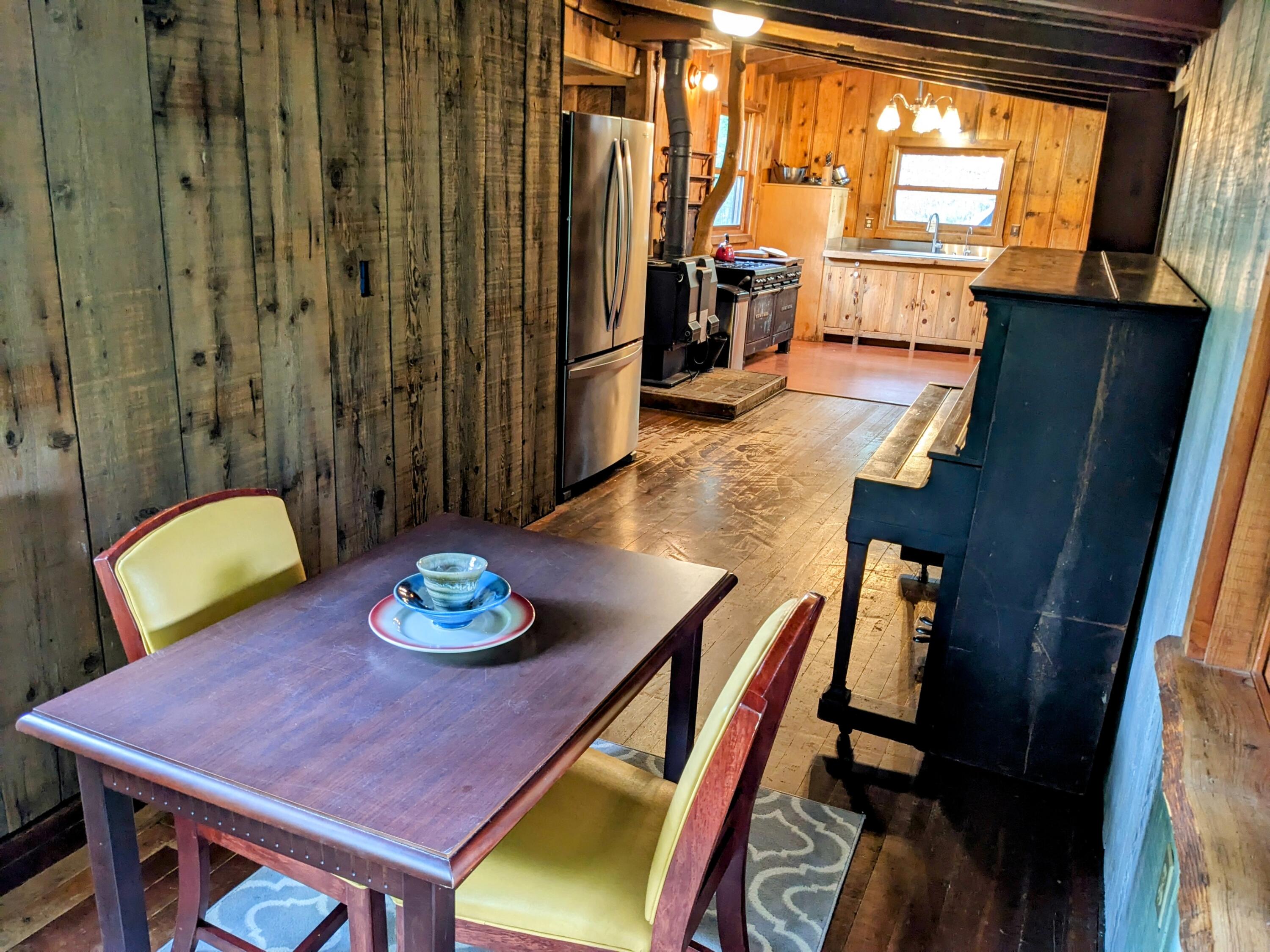 10000 Little Applegate Road Jacksonville, OR 97530 - Photo 20 of 141 a view of a dining room with furniture window and wooden floor