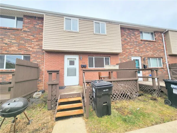 a backyard of a house with seating space