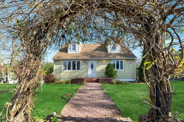 a front view of a house with yard