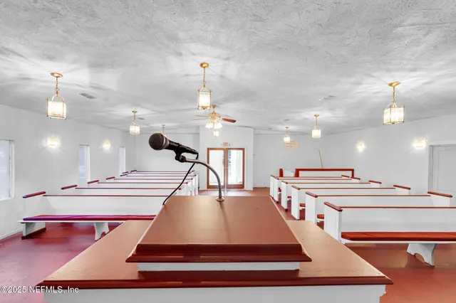 a room with pool table and mirrors