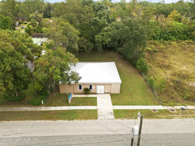 a view of a swimming pool with a yard
