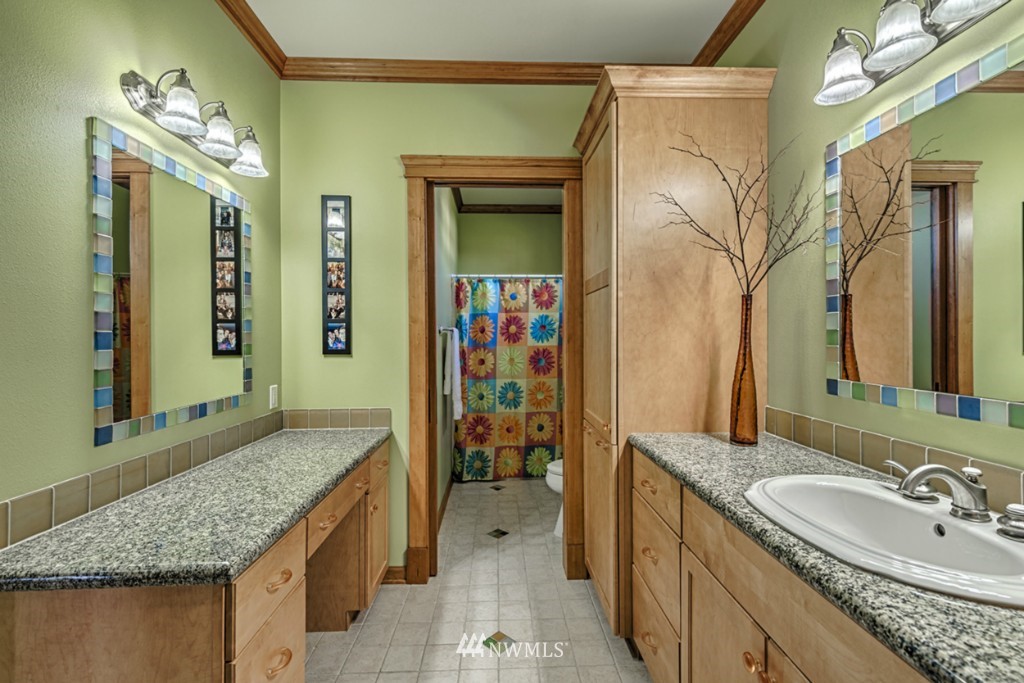 9690 Samish Island Road Bow, WA 98232 - Photo 17 of 25 a bathroom with a granite countertop sink and a mirror