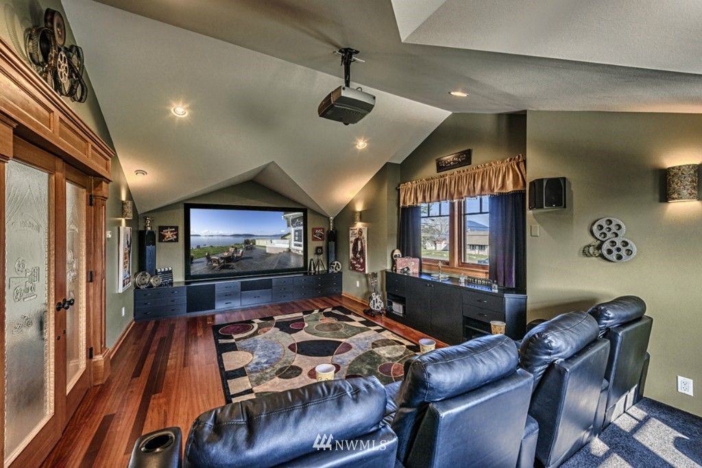 9690 Samish Island Road Bow, WA 98232 - Photo 18 of 25 a living room with furniture and a flat screen tv