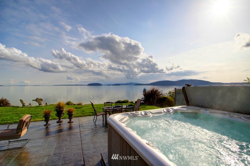 9690 Samish Island Road Bow, WA 98232 - Photo 3 of 25 a view of a swimming pool with an outdoor seating