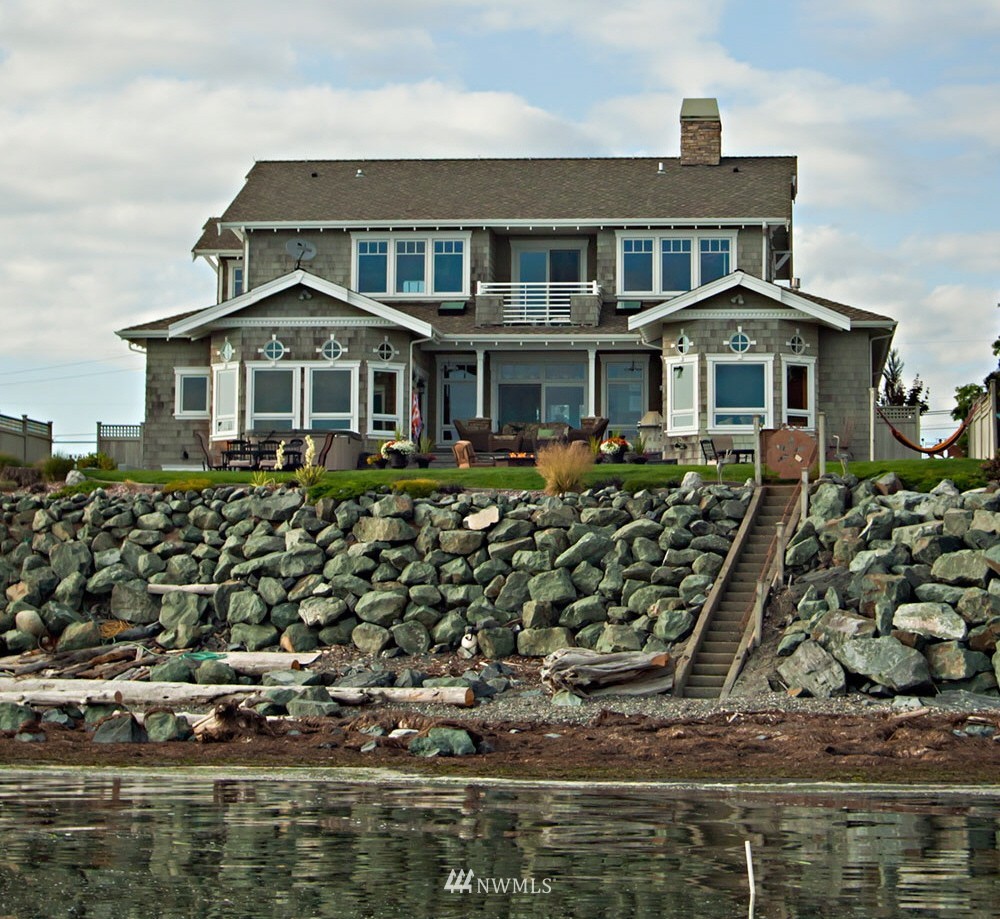 9690 Samish Island Road Bow, WA 98232 - Photo 4 of 25 a front view of a house with a yard