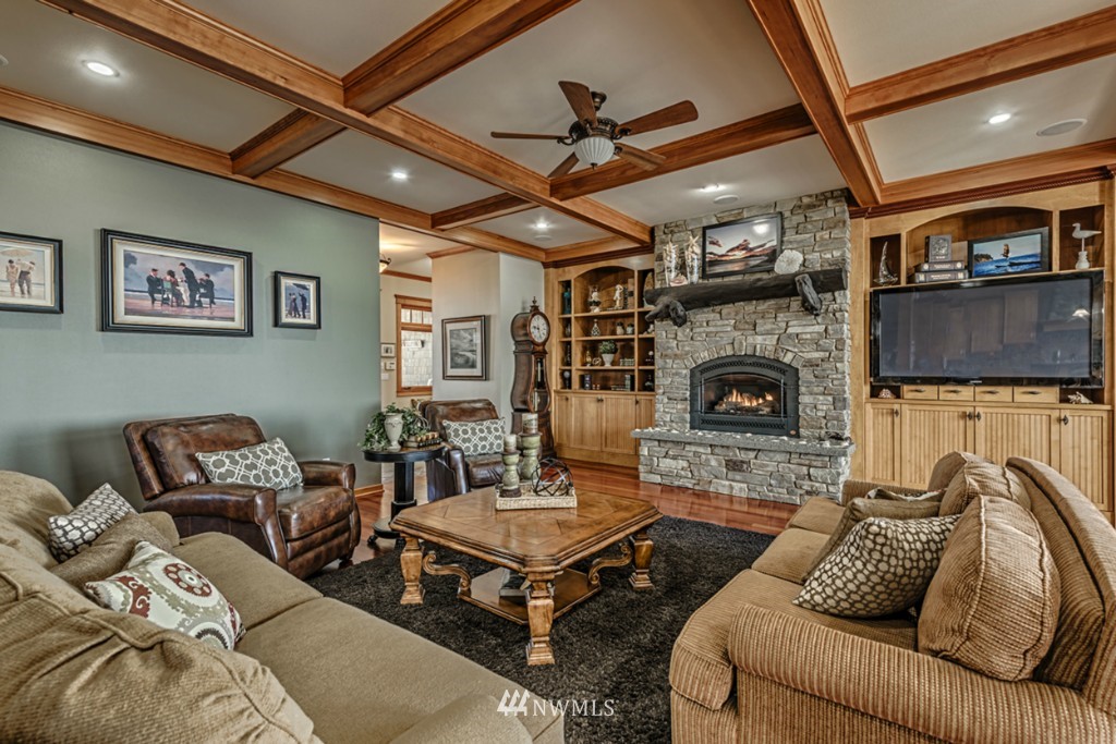 9690 Samish Island Road Bow, WA 98232 - Photo 5 of 25 a living room with furniture and a fireplace
