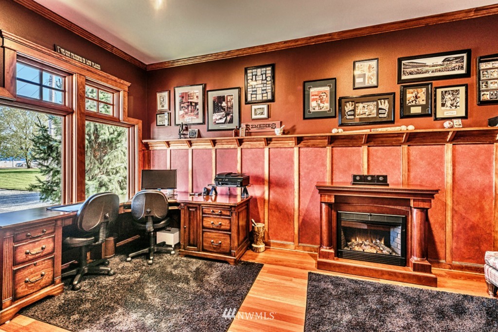 9690 Samish Island Road Bow, WA 98232 - Photo 10 of 25 a living room with furniture a window and a fireplace