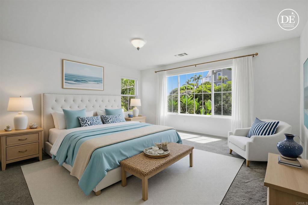 2347 Merwin Drive Carlsbad, CA 92008 - Photo 58 of 78 a bedroom with a bed and a couch