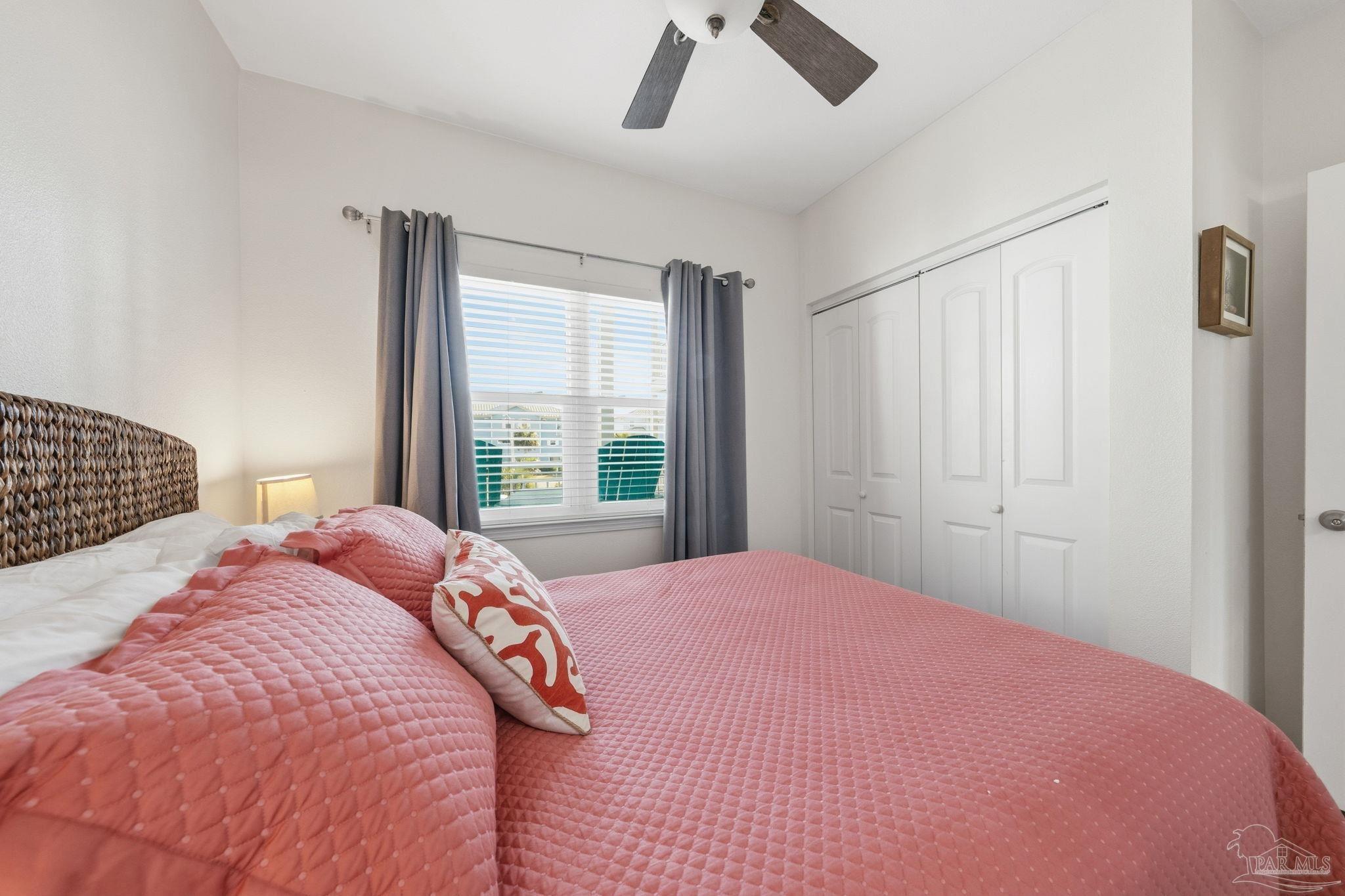 1150 Fort Pickens Road, Unit A3 Pensacola Beach, FL 32561 - Photo 19 of 36 a bedroom with a large bed and a window