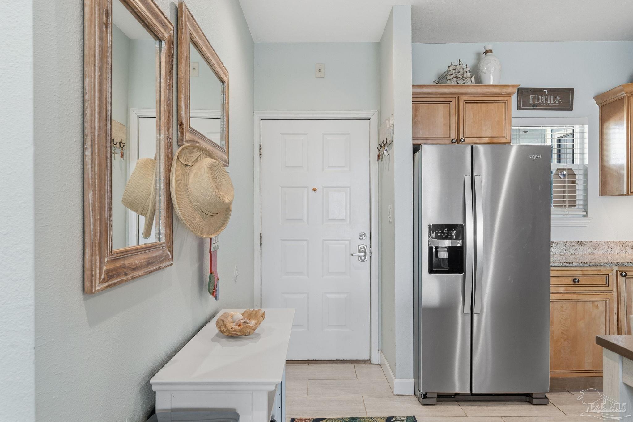 1150 Fort Pickens Road, Unit A3 Pensacola Beach, FL 32561 - Photo 6 of 36 a kitchen with stainless steel appliances granite countertop a refrigerator and a stove