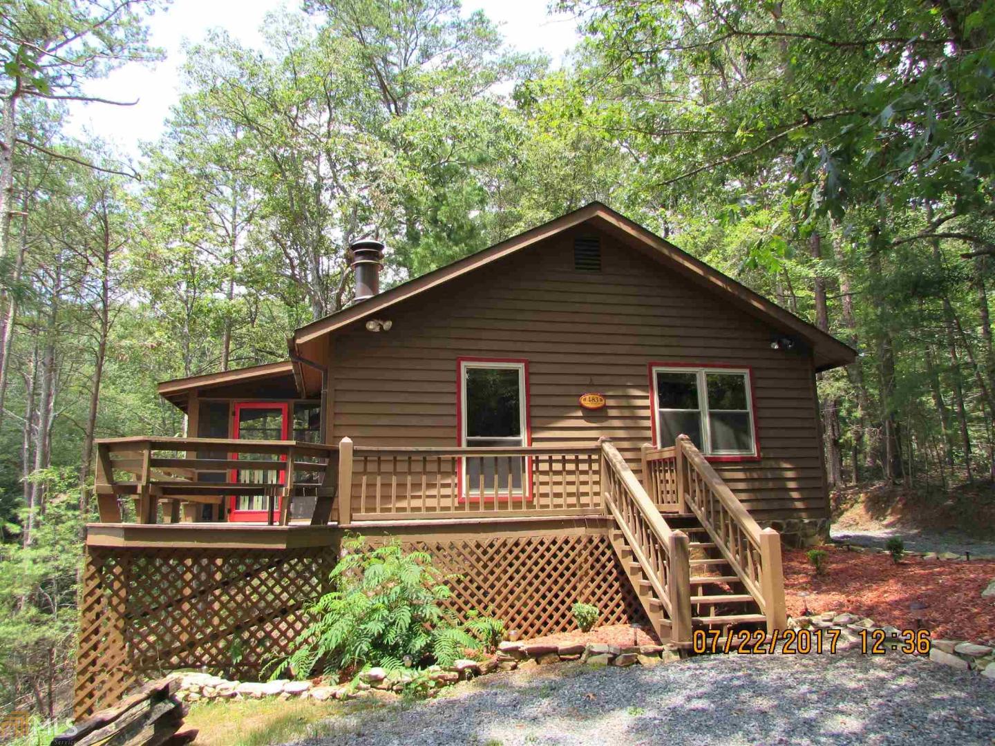 483 Granny Branch Drive, Unit 24 Blue Ridge, GA 30513 - Photo 1 of 1 a front view of a house with garden