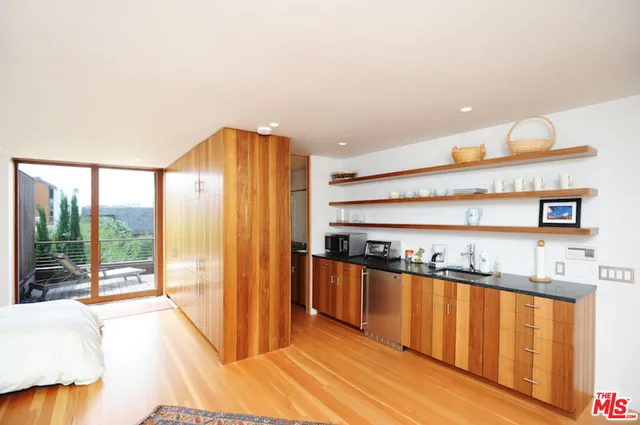 a kitchen with stainless steel appliances granite countertop a stove and a refrigerator