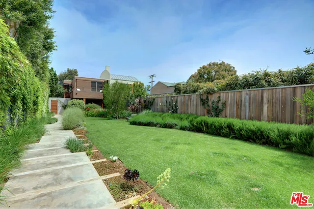 a view of a garden with houses