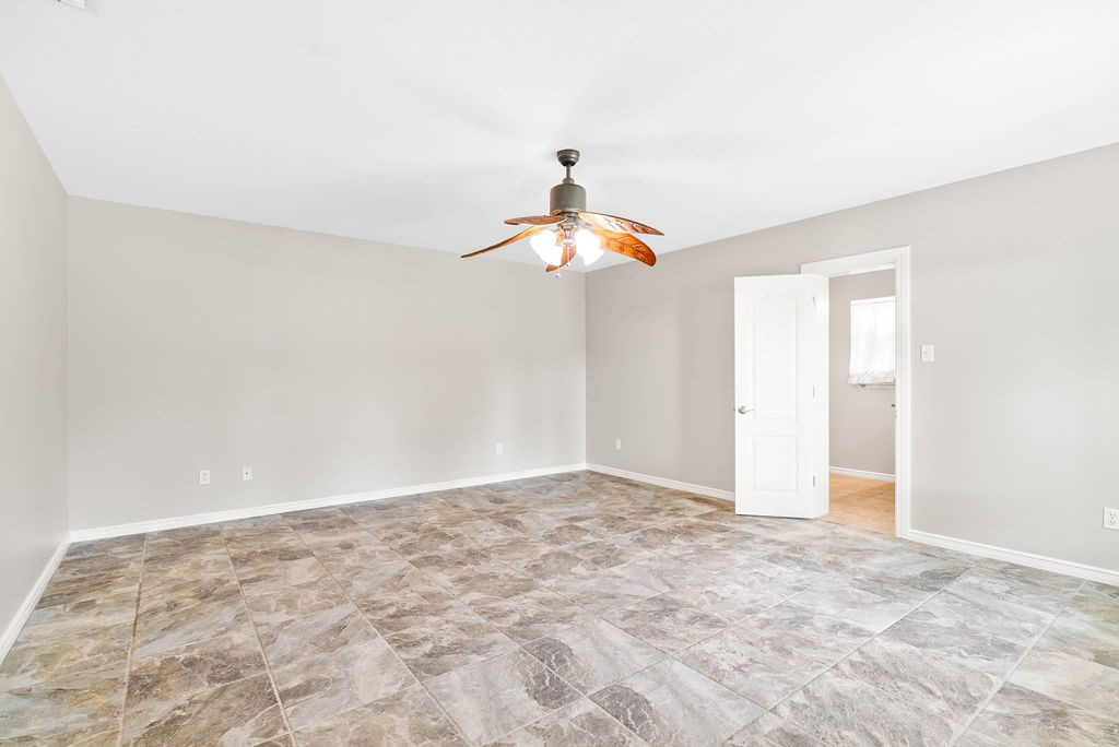 1931 North Fulton Beach Road Rockport, TX 78382 - Photo 33 of 40 a very nice looking room with a ceiling fan