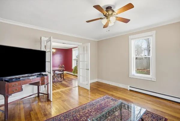 a living room with furniture and a flat screen tv