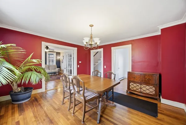 a dining room with furniture and window