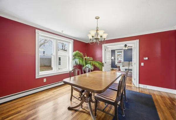 a view of a dining room with furniture and window