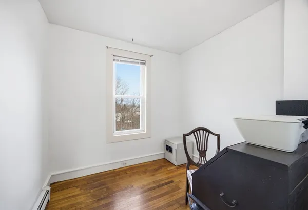 a view of a chair and table in a room