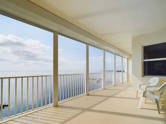 a bedroom with a bed and chair