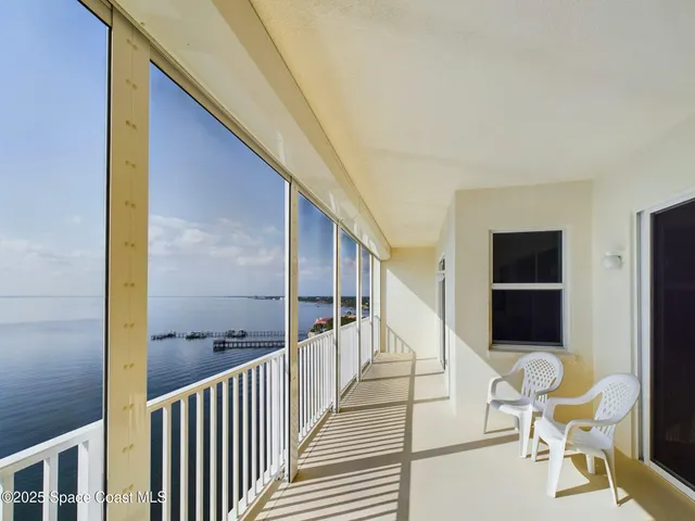 a view of balcony with furniture