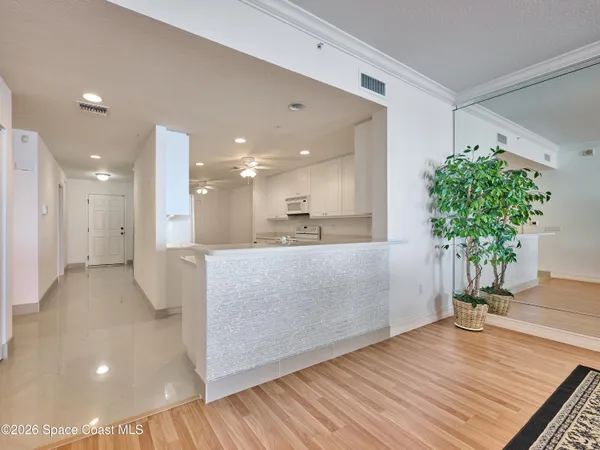 a view of a room with large trees