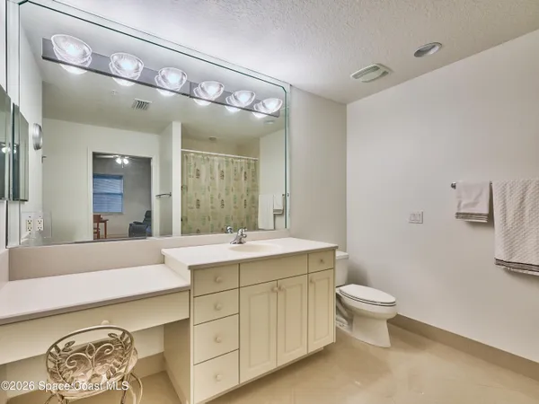 a view of ocean with a multi story building