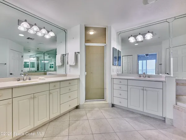 a view of a balcony with a floor to ceiling window and outdoor view