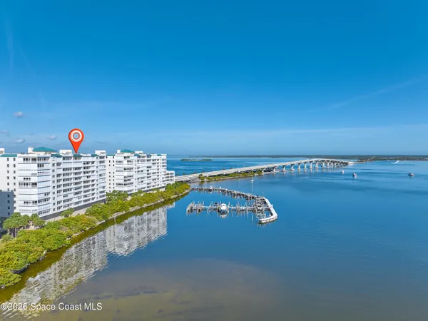 a view of kitchen with cabinets table and chairs