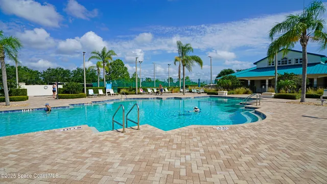 a view of a swimming pool with a patio