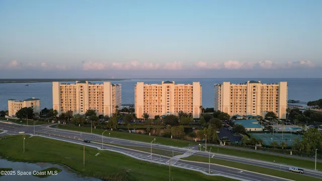 an aerial view of ocean and mountain view