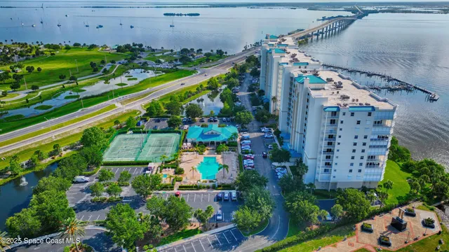an aerial view of a house with a lake view