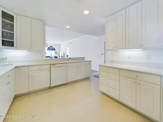 a kitchen with white cabinets
