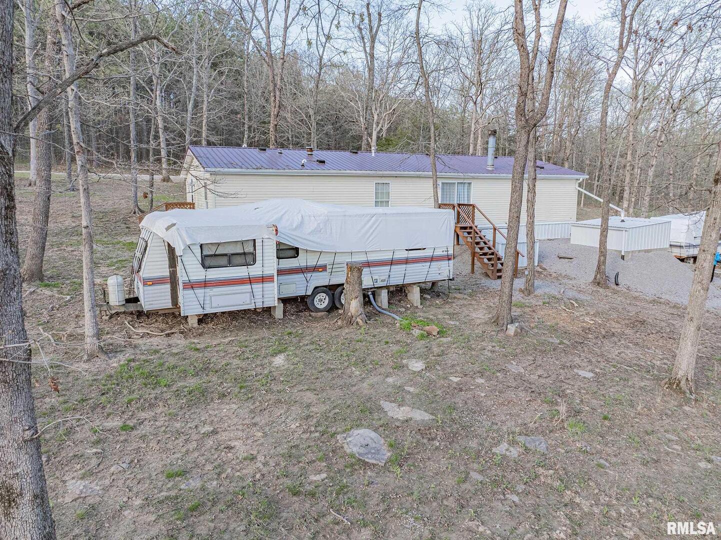 565 Dutton Chapel Road Herod, IL 62947 - Photo 19 of 54 a view of a house with a yard and sitting area