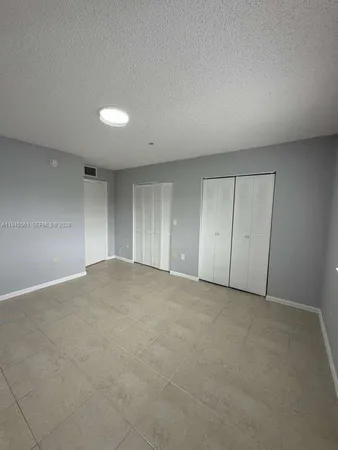 a bathroom with a double vanity sink and mirror