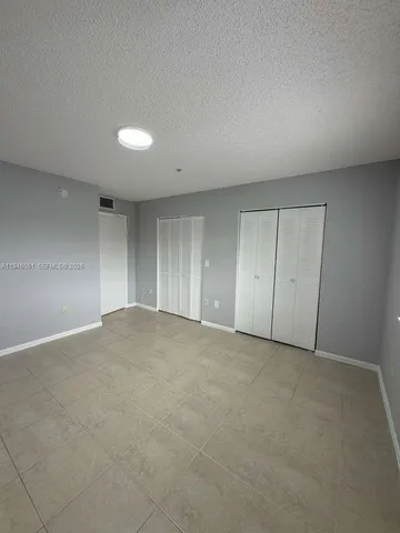 a bathroom with a double vanity sink and mirror