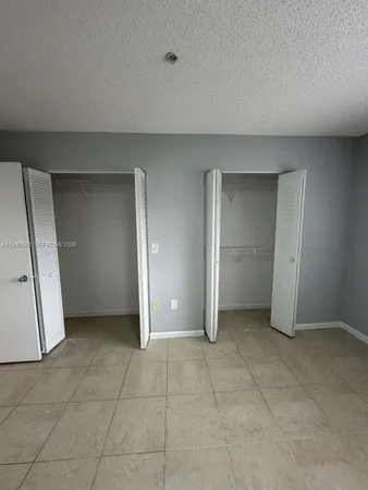 an empty room with a bathroom
