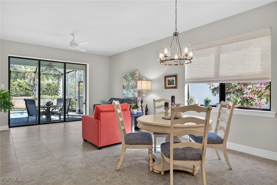 11268 Carlingford Road Fort Myers, FL 33913 - Photo 11 of 48 a dining room with furniture a chandelier and window