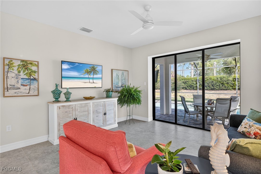 11268 Carlingford Road Fort Myers, FL 33913 - Photo 15 of 48 a living room with furniture and large windows