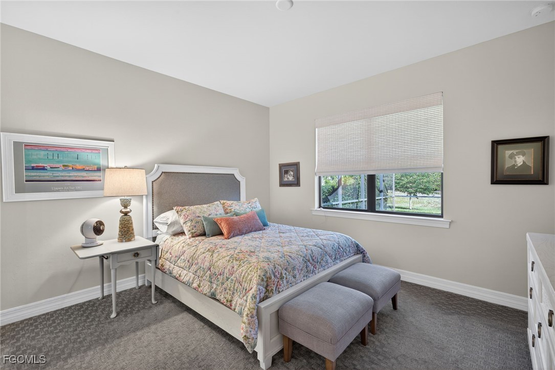 11268 Carlingford Road Fort Myers, FL 33913 - Photo 16 of 48 a bedroom with a bed and a window