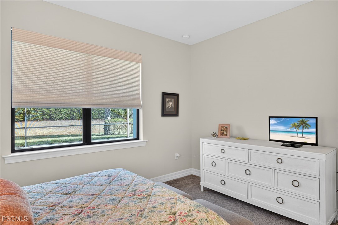 11268 Carlingford Road Fort Myers, FL 33913 - Photo 18 of 48 a bedroom with a bed and a window