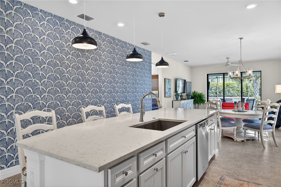 11268 Carlingford Road Fort Myers, FL 33913 - Photo 2 of 48 a kitchen with a sink and a stove top oven