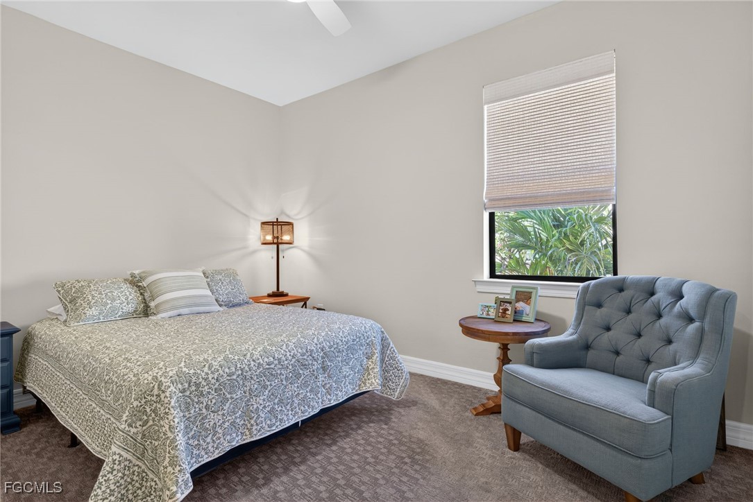 11268 Carlingford Road Fort Myers, FL 33913 - Photo 21 of 48 a bedroom with a bed and a couch