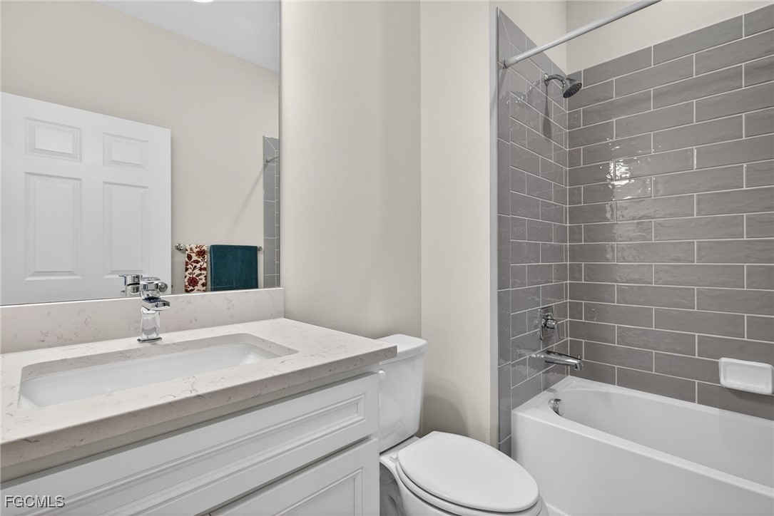 11268 Carlingford Road Fort Myers, FL 33913 - Photo 22 of 48 a bathroom with a sink a toilet and bathtub