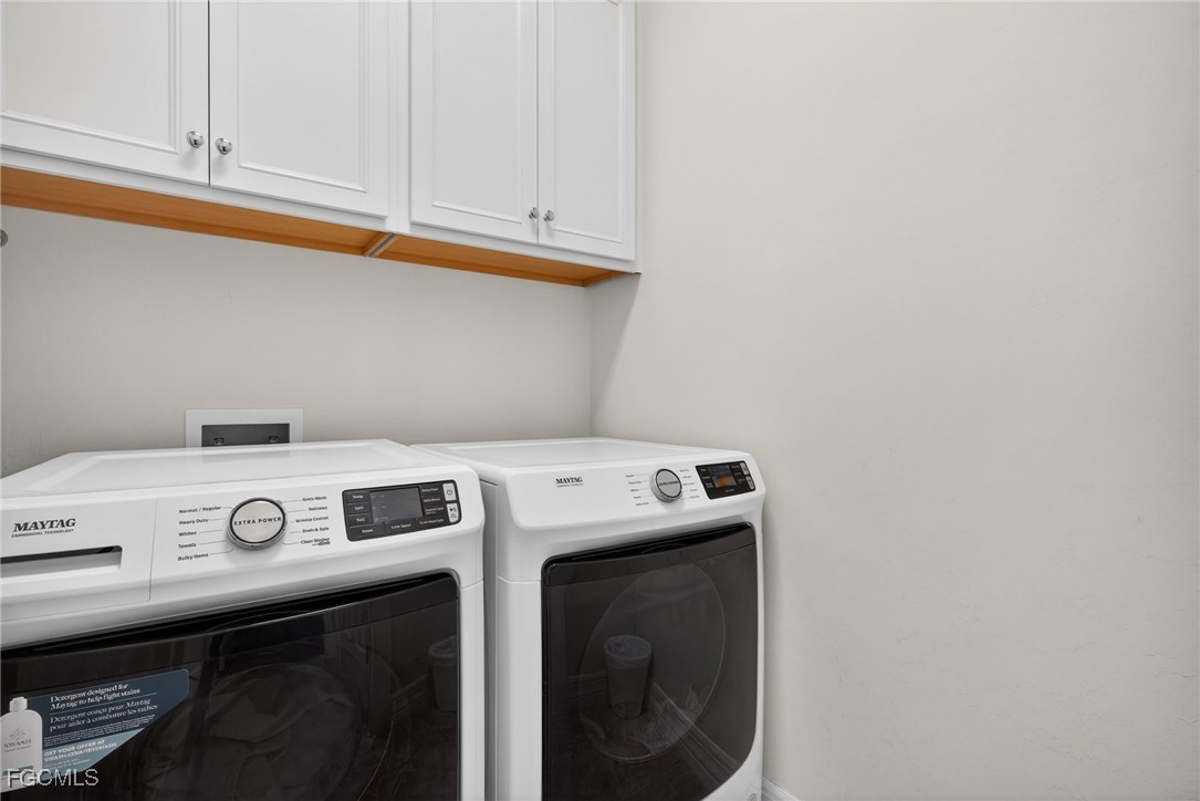 11268 Carlingford Road Fort Myers, FL 33913 - Photo 23 of 48 a utility room with dryer and washer