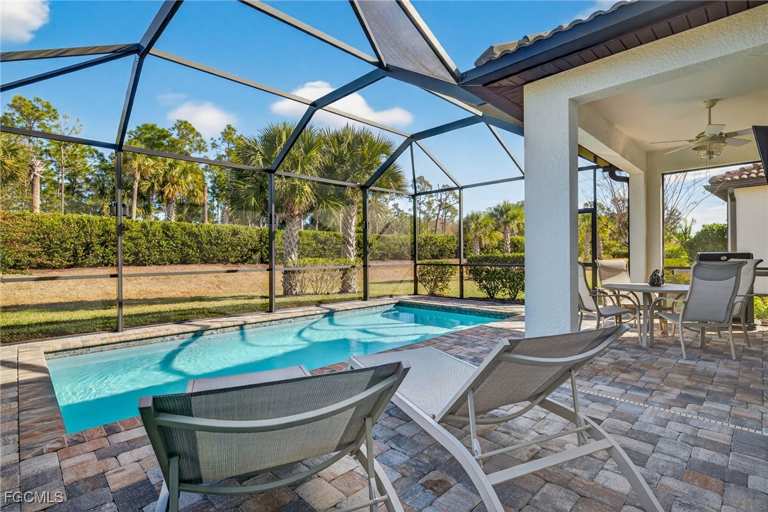 11268 Carlingford Road Fort Myers, FL 33913 - Photo 25 of 48 a backyard of a house with yard and outdoor seating