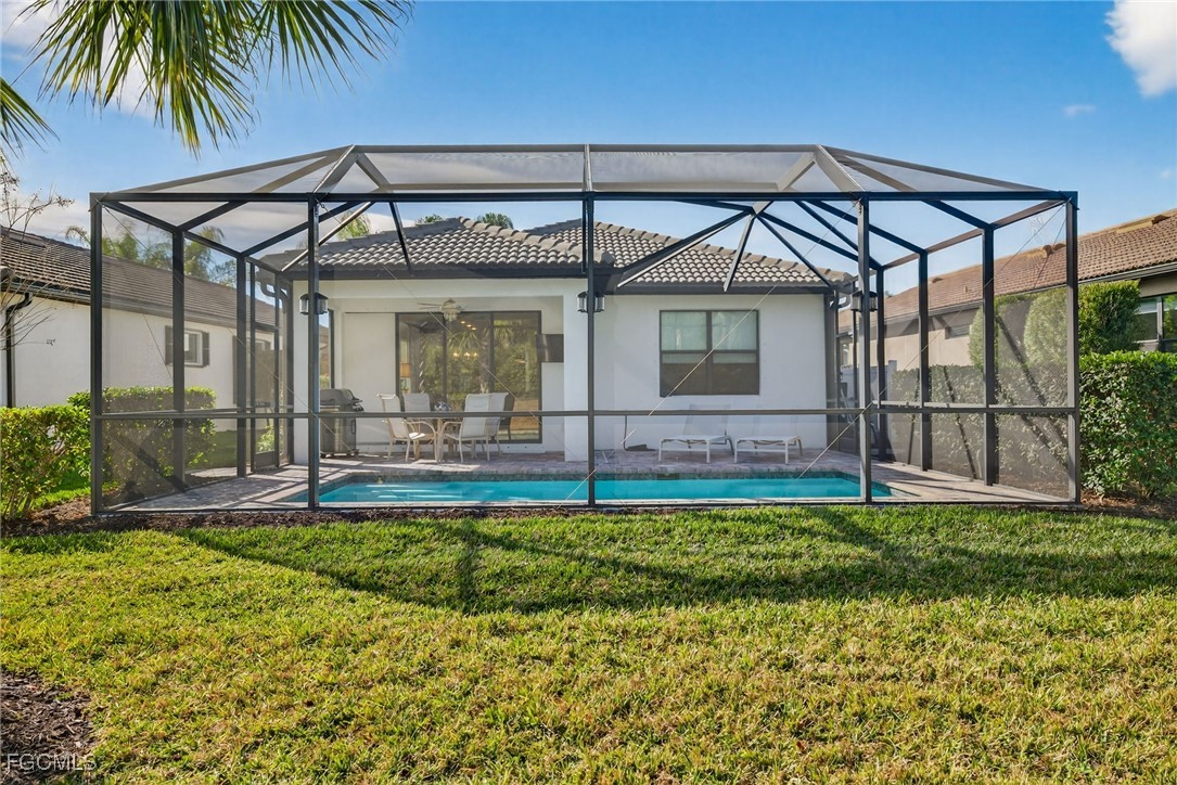 11268 Carlingford Road Fort Myers, FL 33913 - Photo 26 of 48 a view of a house with a yard