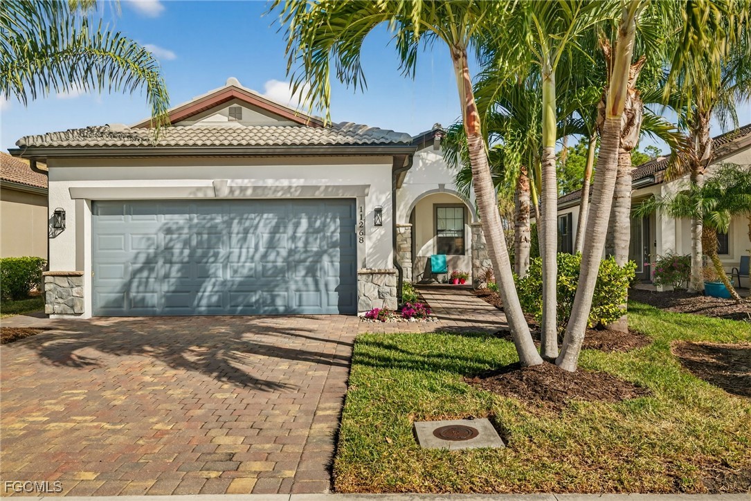 11268 Carlingford Road Fort Myers, FL 33913 - Photo 27 of 48 a front view of a house with garden