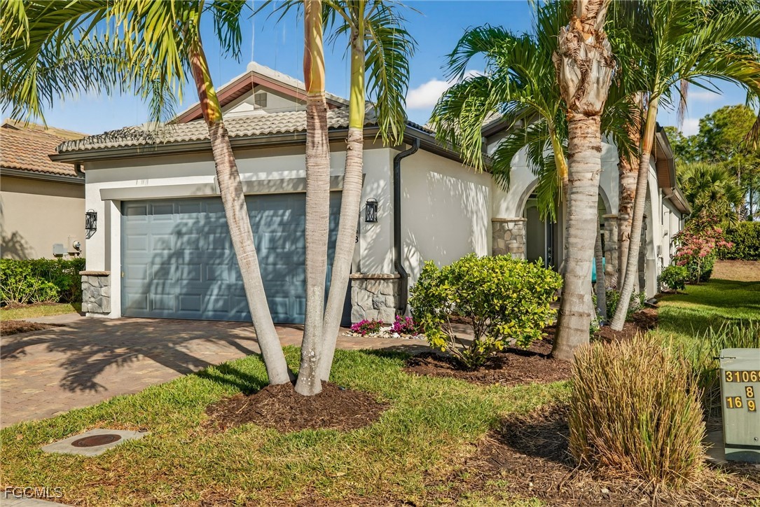 11268 Carlingford Road Fort Myers, FL 33913 - Photo 28 of 48 a front view of a house with garden